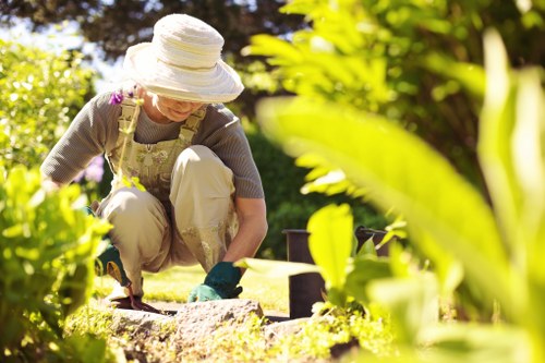 Worker using protective equipment during landscaping tasks
